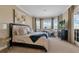 Spacious main bedroom boasts natural light, plush bedding and exterior view at 2375 Pinehurst Ct, Davenport, FL 33837