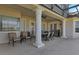 Spacious outdoor patio with seating and grill, perfect for entertaining and enjoying outdoor living at 2375 Pinehurst Ct, Davenport, FL 33837