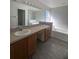 Double vanity in a bathroom with a bathtub and shower at 2438 Winfield Dr, Kissimmee, FL 34743