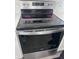 Modern stainless steel oven with digital controls and a sleek glass cooktop at 2438 Winfield Dr, Kissimmee, FL 34743
