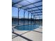 Outdoor screened-in pool area with scenic lake views at 2438 Winfield Dr, Kissimmee, FL 34743
