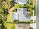 Aerial view of the property showcasing the pool and surrounding landscape at 2539 Jasmine Trace Dr, Kissimmee, FL 34758