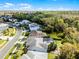 Home with a screened pool, complemented by lush greenery and neighborhood charm at 2539 Jasmine Trace Dr, Kissimmee, FL 34758