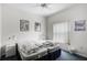 Bright bedroom features two beds, ceiling fan and natural light at 2539 Jasmine Trace Dr, Kissimmee, FL 34758