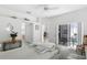 Spacious main bedroom with a ceiling fan and access to a screened-in outdoor patio at 2539 Jasmine Trace Dr, Kissimmee, FL 34758
