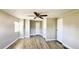 Bedroom featuring neutral walls, light wood-look flooring, and closet doors at 2601 Salina Way, Kissimmee, FL 34758