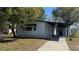 Exterior close-up showcasing a single-story home with a covered carport and walkway at 2601 Salina Way, Kissimmee, FL 34758