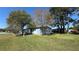 Single story home with light blue siding and a green lawn at 2601 Salina Way, Kissimmee, FL 34758