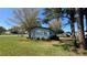 Single story home with light blue siding and a green lawn at 2601 Salina Way, Kissimmee, FL 34758