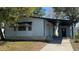Charming single-story home featuring a covered carport and light blue siding at 2601 Salina Way, Kissimmee, FL 34758