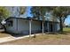 This single-story home has a covered carport and light blue siding at 2601 Salina Way, Kissimmee, FL 34758