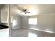 Well-lit living room featuring wood floors and neutral-colored walls at 2601 Salina Way, Kissimmee, FL 34758