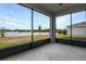 Screened patio with views of the backyard and surrounding green space at 276 Hilltop Bloom Loop, Haines City, FL 33844