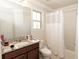 Cozy bathroom featuring a vanity with granite countertop, a toilet, and a shower/tub combination at 2804 Alpine Meadow Ln, Kissimmee, FL 34744