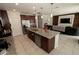 Well-equipped kitchen with a center island, stainless steel appliances, and granite countertops at 2804 Alpine Meadow Ln, Kissimmee, FL 34744