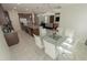 Open-concept kitchen and dining area with granite countertops and stainless steel appliances at 2804 Alpine Meadow Ln, Kissimmee, FL 34744