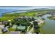 Stunning aerial view showcasing the community's amenities, waterfront homes, and lush landscaping at 2981 Winding Trl, Kissimmee, FL 34746