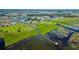 Expansive aerial view of the community with waterfront properties and a scenic boardwalk at 2981 Winding Trl, Kissimmee, FL 34746