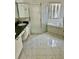 Bathroom featuring a glass shower stall, a soaking tub, and dual sinks at 2981 Winding Trl, Kissimmee, FL 34746