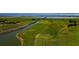 Aerial view of a boardwalk winding through a scenic marsh area for nature walks at 2981 Winding Trl, Kissimmee, FL 34746