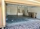 Spacious two car garage with white walls and electric garage door opener at 2981 Winding Trl, Kissimmee, FL 34746