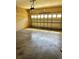 Spacious garage with a concrete floor, cinder block walls, and an insulated garage door at 2981 Winding Trl, Kissimmee, FL 34746