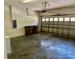 Spacious garage with a garage door opener, concrete walls, and room for parking at 2981 Winding Trl, Kissimmee, FL 34746