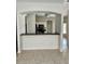 Open-concept kitchen features a breakfast bar and views into adjacent rooms at 2981 Winding Trl, Kissimmee, FL 34746