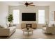 Airy living room featuring neutral colors, a ceiling fan, and natural light at 2981 Winding Trl, Kissimmee, FL 34746