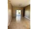 Bright living room featuring tile floors and sliding glass doors to the backyard at 2981 Winding Trl, Kissimmee, FL 34746