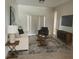 Bright living room showcasing stylish decor, a cozy armchair, and a large window for ample natural light at 2981 Winding Trl, Kissimmee, FL 34746