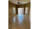 Spacious living room featuring tile floors, neutral walls, and sliding glass doors at 2981 Winding Trl, Kissimmee, FL 34746