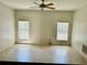 Bright living room features neutral paint and tile flooring at 2981 Winding Trl, Kissimmee, FL 34746
