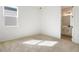 Bright bedroom with neutral carpet and a view into the ensuite bathroom at 2985 Gavin Sky Dr, Kissimmee, FL 34744
