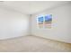 Cozy bedroom with plush carpet and a window providing natural light at 2985 Gavin Sky Dr, Kissimmee, FL 34744