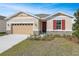 Charming single-Gathering home with a well-manicured lawn and stone accents at 2985 Gavin Sky Dr, Kissimmee, FL 34744