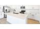 Modern kitchen with white cabinetry, stainless steel appliances, and a large center island at 2985 Gavin Sky Dr, Kissimmee, FL 34744