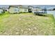 Large backyard, perfect for Gathering activities, features a trampoline and basketball hoop at 3082 Royal Tern Dr, Winter Haven, FL 33881