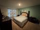 View of the spacious bedroom with a queen size bed and nice neutral decor at 3082 Royal Tern Dr, Winter Haven, FL 33881