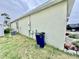 Home exterior features various utilities neatly installed and healthy landscaping at 3082 Royal Tern Dr, Winter Haven, FL 33881