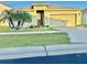 Charming single-story home featuring a well-manicured lawn and vibrant tropical landscaping at 3082 Royal Tern Dr, Winter Haven, FL 33881