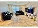 Inviting living room with comfortable seating and a modern entertainment center at 3082 Royal Tern Dr, Winter Haven, FL 33881