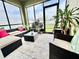 An enclosed sunroom features comfortable wicker furniture and views of the backyard and greenery at 3082 Royal Tern Dr, Winter Haven, FL 33881
