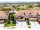 Aerial view of townhomes with well-manicured landscaping and private driveways at 3102 Ashland N Ln # 3152, Kissimmee, FL 34741