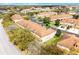 An aerial view of the community showcasing multiple townhomes with well-maintained landscaping at 3102 Ashland N Ln # 3152, Kissimmee, FL 34741
