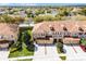 Aerial view of townhomes with well-manicured landscaping and private driveways at 3102 Ashland N Ln # 3152, Kissimmee, FL 34741