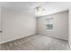 Neutral bedroom featuring a ceiling fan and a window with a blinds at 3102 Ashland N Ln # 3152, Kissimmee, FL 34741