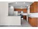 Kitchen with wood cabinets, stainless steel appliances, and light countertops at 3102 Ashland N Ln # 3152, Kissimmee, FL 34741