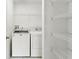 Laundry room featuring white washer and dryer and wire shelving at 3102 Ashland N Ln # 3152, Kissimmee, FL 34741