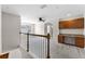 Upstairs loft area with built-in desk, storage cabinets and neutral-colored walls at 3102 Ashland N Ln # 3152, Kissimmee, FL 34741